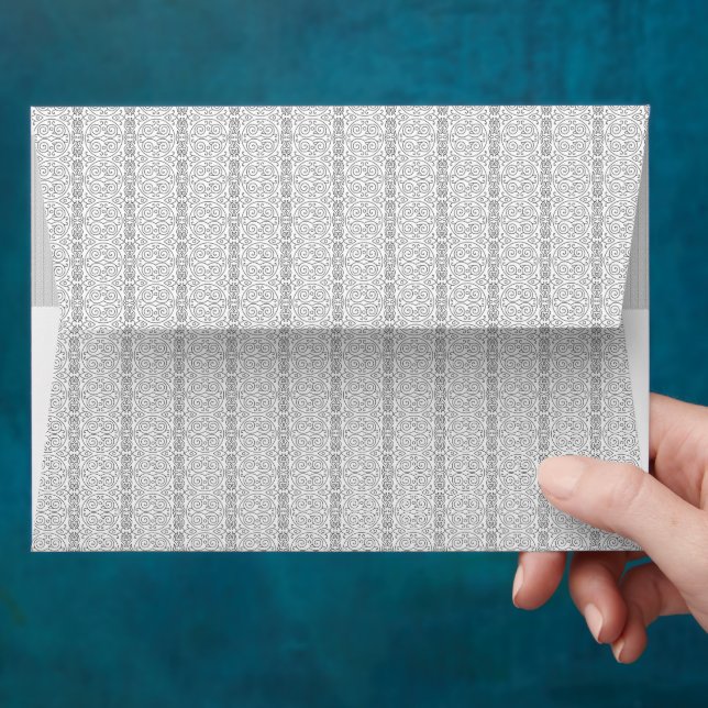 a white and grey wallpaper with a pattern on it envelope (Hand)