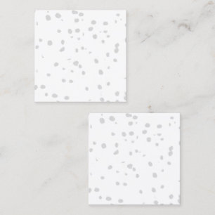 a white background with a lot of small dots calling card