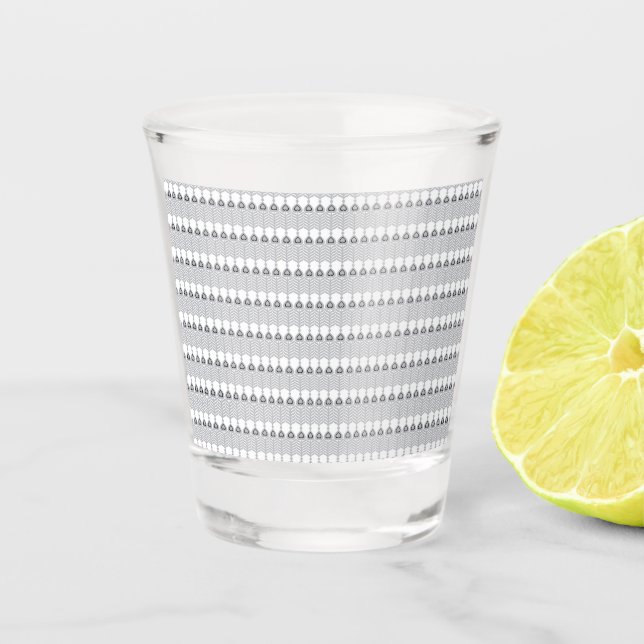  a white background with a pattern of circles shot glass (Front)