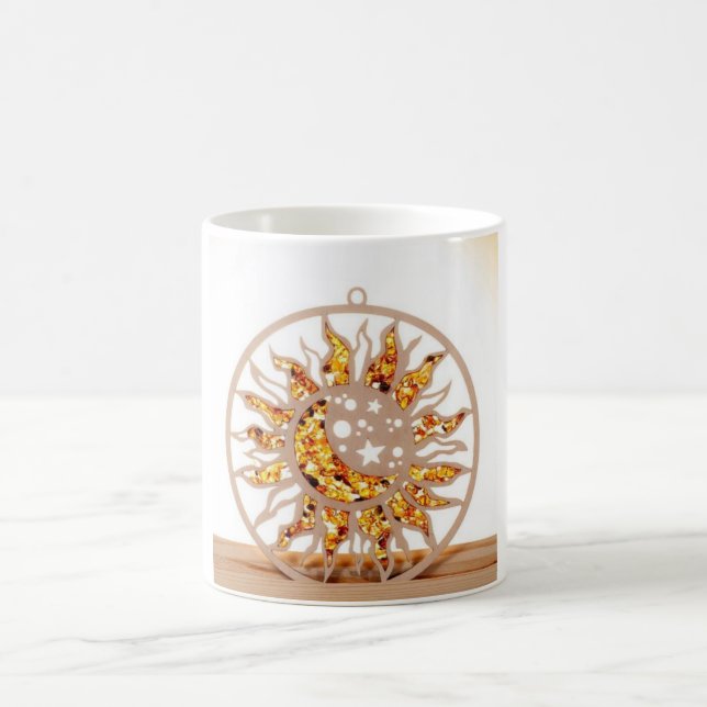 a white mug with an image of sun and moon (Centre)