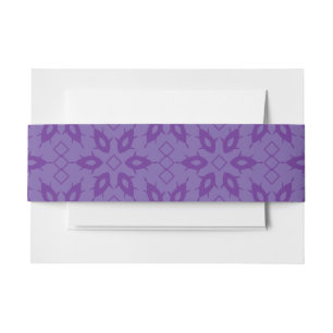 A white wrapping paper with a repeating pattern of invitation belly band