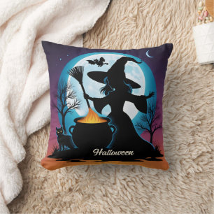 A witch brews up magic under a full moon throw pillow