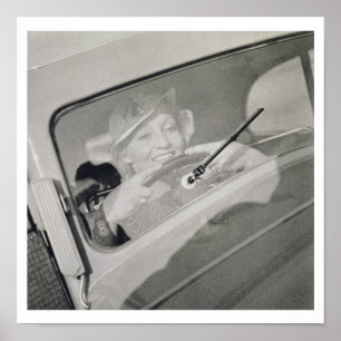A woman driving, c.1930s (photogravure) poster