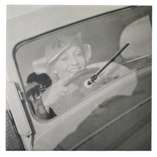 A woman driving, c.1930s (photogravure) tile