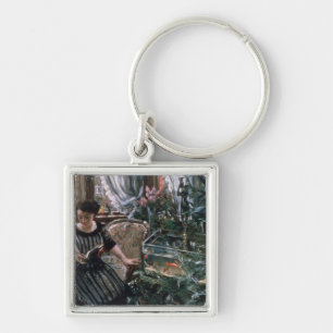 A Woman Reading near a Goldfish Tank Keychain