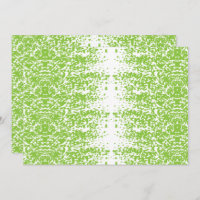 A woman wearing a grey sweater and glasses sits by