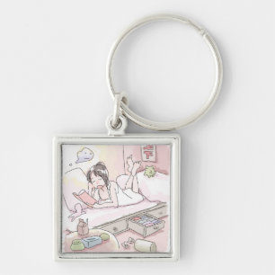 A woman's illustration of a pink bedroom lying dow keychain