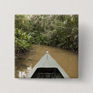 A wooden canoe made of Eucylptus tree floats in 2 Inch Square Button