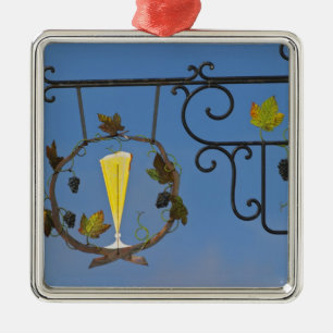 A wrought iron sign that illustrates the theme metal ornament