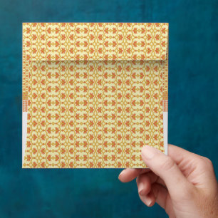 a yellow and white background with an intricate de envelope