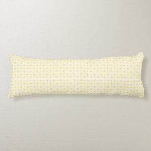 a yellow and white background with small circles body pillow