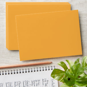 a yellow background with a black border envelope
