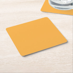 a yellow background with a black border square paper coaster