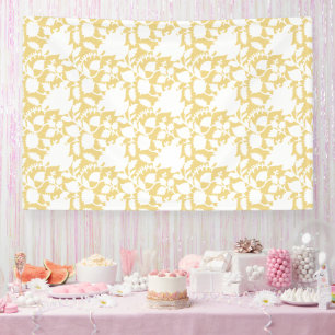 A yellow rug with a repeating motif pattern resemb banner