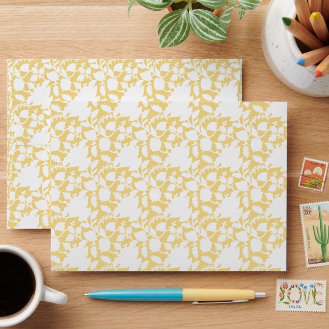 A yellow rug with a repeating motif pattern resemb envelope (Desk)