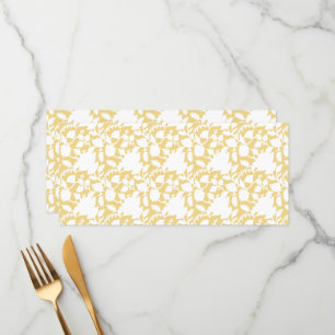 A yellow rug with a repeating motif pattern resemb menu