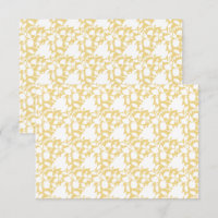 A yellow rug with a repeating motif pattern resemb
