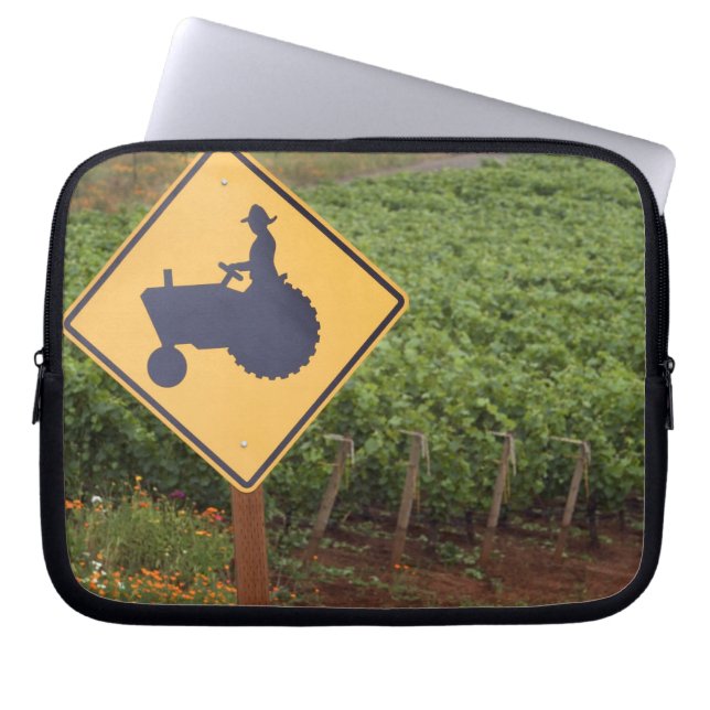 A yellow tractor crossing sign in the vineyard laptop sleeve (Front)