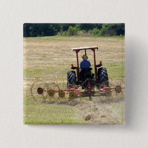 A young boy driving a tractor harvesting 2 inch square button