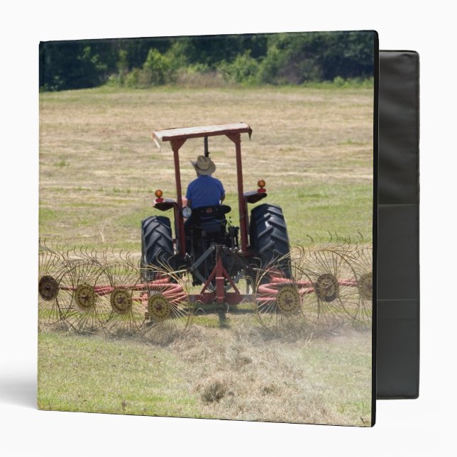 A young boy driving a tractor harvesting binder (Front/Inside)