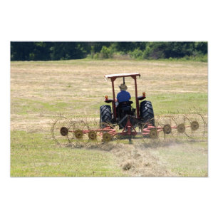 A young boy driving a tractor harvesting photo print