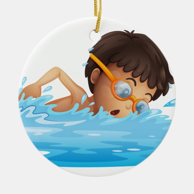 A young boy swimming with a yellow goggles ceramic ornament (Front)