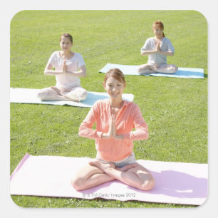 A young woman doing yoga square sticker