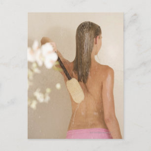 A young woman in a shower postcard
