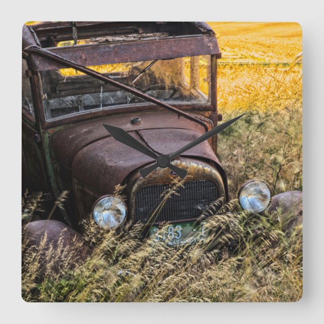 Abandoned old car in tall grass square wall clock (Front)