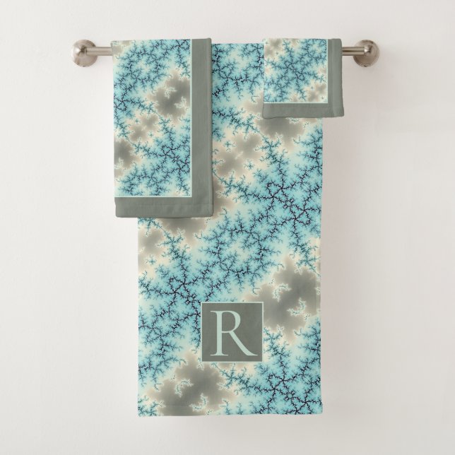 Abstract blue, grey snowflake pattern and monogram bath towel set (Insitu)