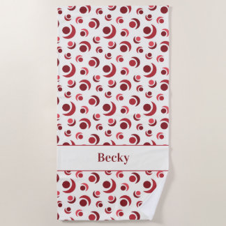 Abstract circles and crescents in red plus Name Beach Towel
