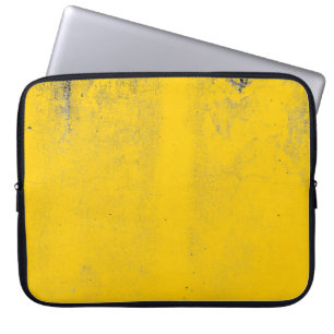 Abstract colourful yellow cement wall texture and laptop sleeve
