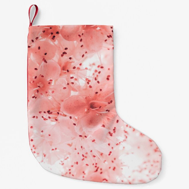 Abstract floral backdrop of pink flowers over past small christmas stocking (Front)