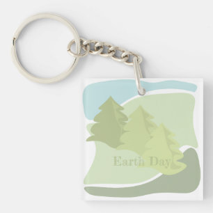 Abstract natural landscape with fir trees and sky keychain
