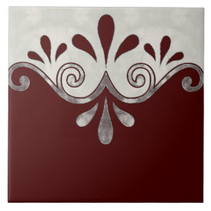 Abstract ornamental shape in burgundy and silver tile