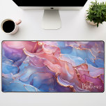 Abstract Pink Purple And Gold Personalized Desk Mat<br><div class="desc">Elevate your workspace with this personalized desk mat featuring a captivating abstract design in vibrant pink and soothing purple hues, accented with luxurious gold foil. The dynamic shapes and contrasting colours create a visually stunning and inspiring backdrop for your work. Make it truly yours by adding your name or a...</div>