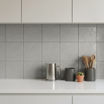 Abstract Plaster Brush Texture Greige ID1287 Tile<br><div class="desc">This ceramic tile features an abstract texture inspired by sweeping brush strokes and hand-troweled plaster finishes. The elegant neutral, medium greige color enhances the tile’s contemporary appeal while remaining highly versatile for a variety of interior styles including modern, industrial, minimalist, and Japandi-inspired spaces. Perfect for backsplashes, fireplace surrounds, feature walls,...</div>