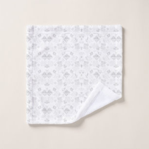 Abstract repeating pattern of stylized shapes in l bath towel set