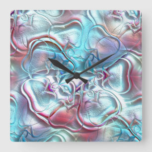 Abstract shapes in glass overlaid on sandy texture square wall clock