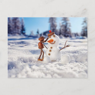 Acorn elf making a snowman winter postcard
