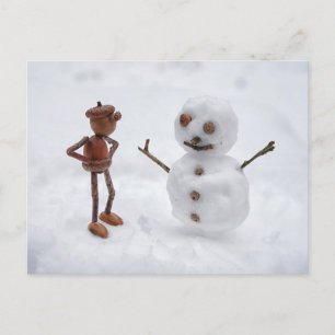 Acorn elf making a snowman winter postcard