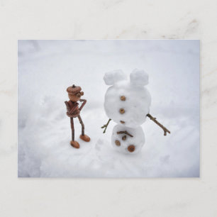 Acorn elf making a snowman winter postcard