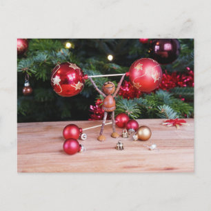 Acorn elf playing with Christmas decorations Postcard
