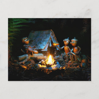 Acorn elves around the campfire at the campsite postcard