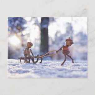 Acorn elves ride on a sleigh winter postcard