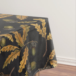 Acorns and oak leaves on black tablecloth