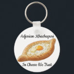 Adjarian Khachapuri  Keychain<br><div class="desc">Adjarian Khachapuri is a traditional Georgian dish from the region of Adjara, located along the Black Sea coast of Georgia. It is a boat-shaped bread made from soft yeast dough, filled with melted cheese, and topped with a fresh egg yolk and a slice of butter. Before eating, the egg and...</div>