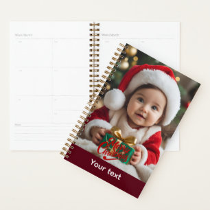 Adorable Baby in Santa Outfit with Christmas Gift Planner