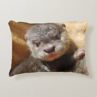 Adorable baby otter throw pillow