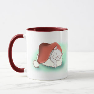 Adorable Christmas Cat Snoozing in Santa Hat Mug